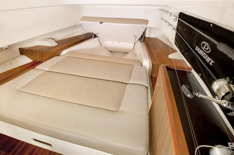 Slide: The Image of Manufacturer Provided Image: Interior cabin of a 2021 Pursuit S 328 Sport boat with cushioned seating. - 25