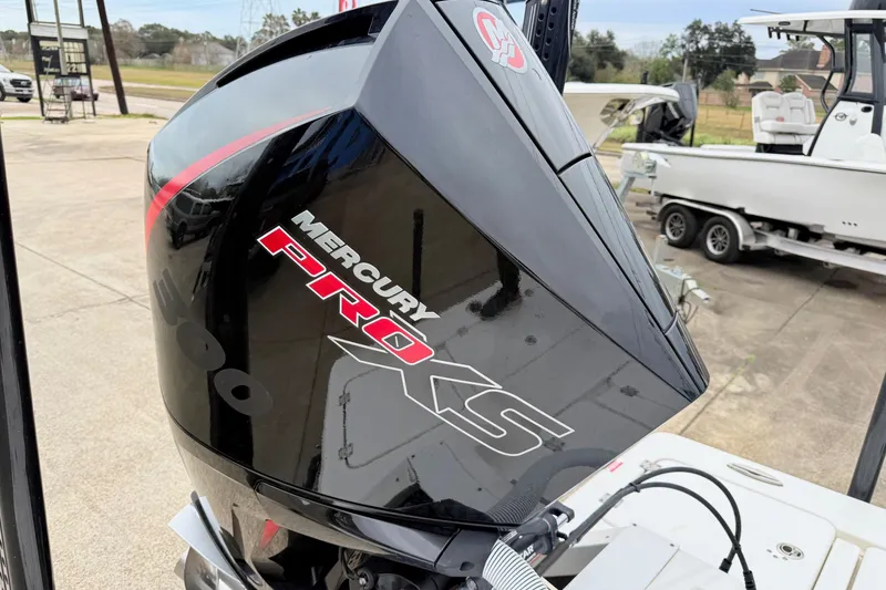 Slide: The Image of 2023 Tidewater 25 TPC Raptor with Mercury Pro XS outboard engine, parked on a trailer. - 18