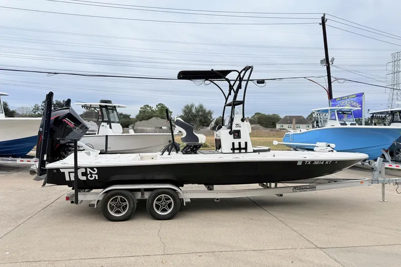 Slide: The Image of 2023 Tidewater 25 TPC Raptor boat on trailer, displayed outdoors. - 4