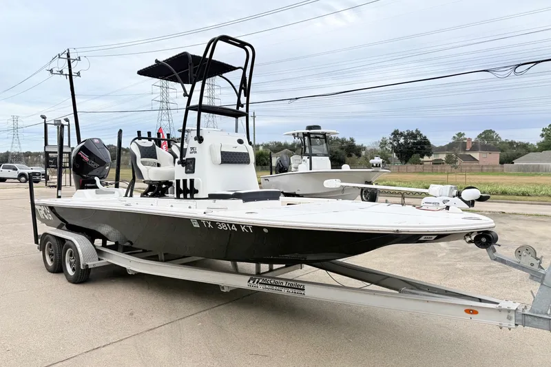 Slide: The Image of 2023 Tidewater 25 TPC Raptor boat on trailer, parked outdoors. - 5