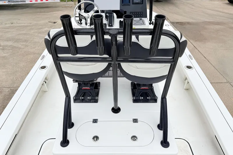 Slide: The Image of 2023 Tidewater 25 TPC Raptor boat interior with rod holders and seating. - 7