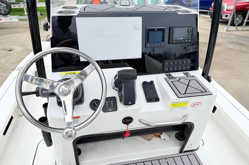 Slide: The Image of 2023 Tidewater 25 TPC Raptor boat console with steering wheel and navigation controls. - 9