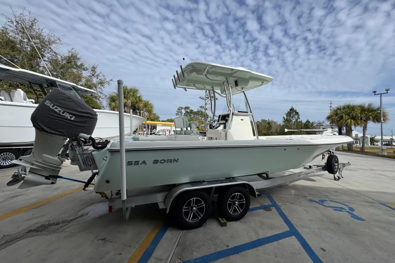 Slide: The Image of 2017 Sea Born FX25 Bay boat on trailer with Suzuki outboard motor. - 10