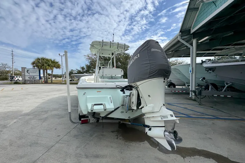 Slide: The Image of 2017 Sea Born FX25 Bay boat with Suzuki outboard motor in a marina setting. - 14