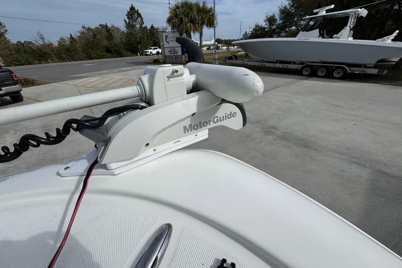 Slide: The Image of 2017 Sea Born FX25 Bay boat with MotorGuide trolling motor in a parking lot. - 21