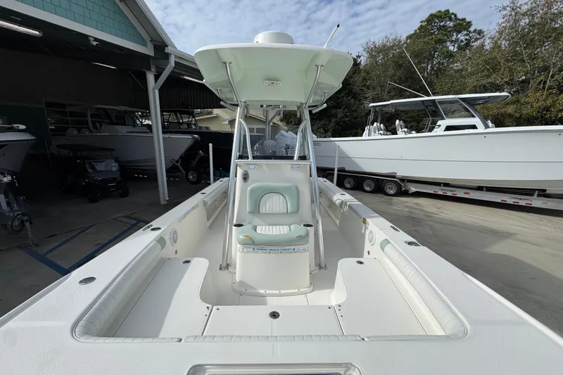 Slide: The Image of 2017 Sea Born FX25 Bay boat with T-top, docked outdoors. - 24