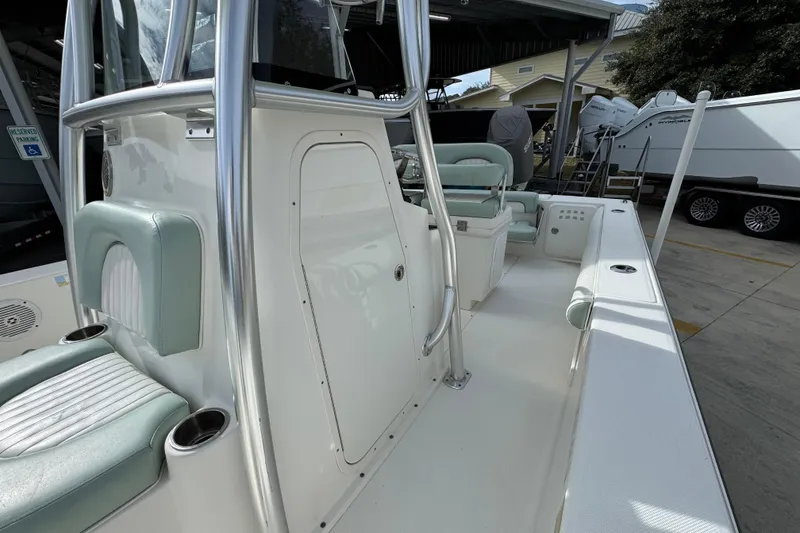 Slide: The Image of 2017 Sea Born FX25 Bay boat interior with seating and storage features. - 25
