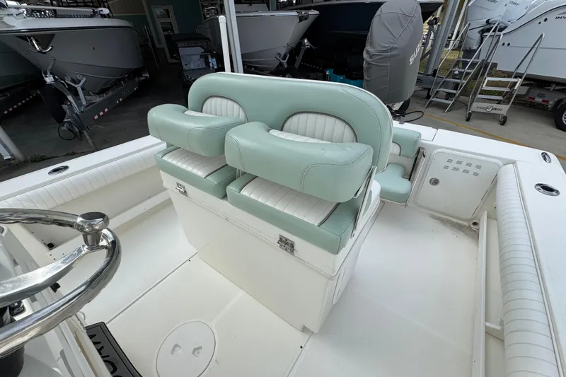 Slide: The Image of 2017 Sea Born FX25 Bay boat interior with mint green seating and steering wheel. - 27
