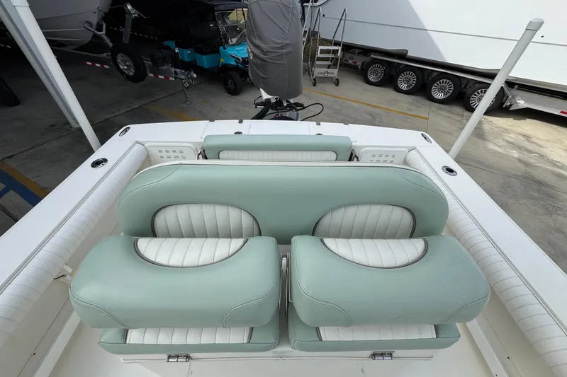 Slide: The Image of 2017 Sea Born FX25 Bay boat with mint green and white seating. - 28