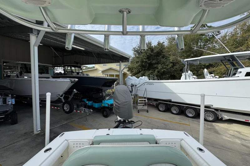 Slide: The Image of 2017 Sea Born FX25 Bay boat in a marina with other boats. - 29