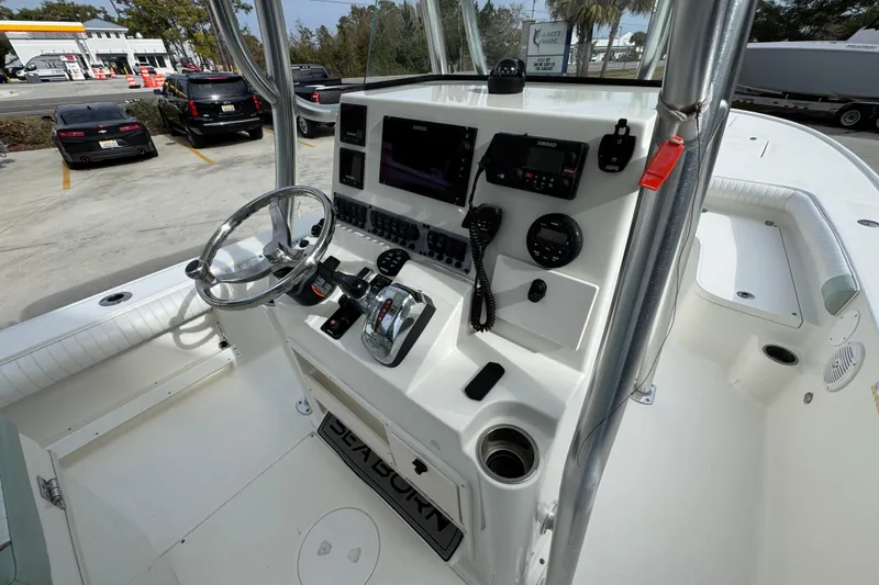 Slide: The Image of 2017 Sea Born FX25 Bay boat console with steering wheel and navigation controls. - 34