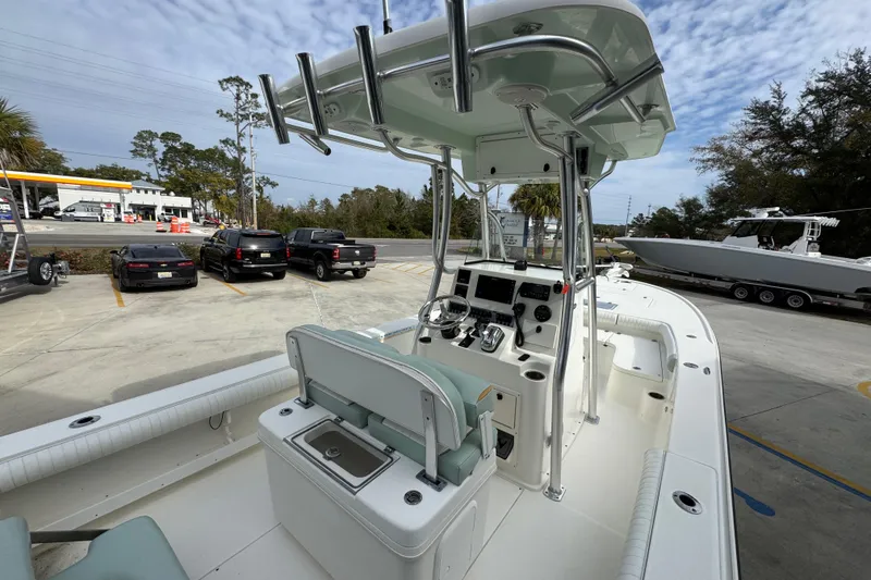 Slide: The Image of 2017 Sea Born FX25 Bay boat with center console and T-top in a parking lot. - 36