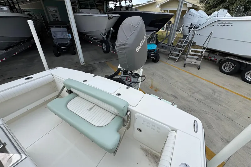 Slide: The Image of 2017 Sea Born FX25 Bay boat with Suzuki outboard motor in storage facility. - 37