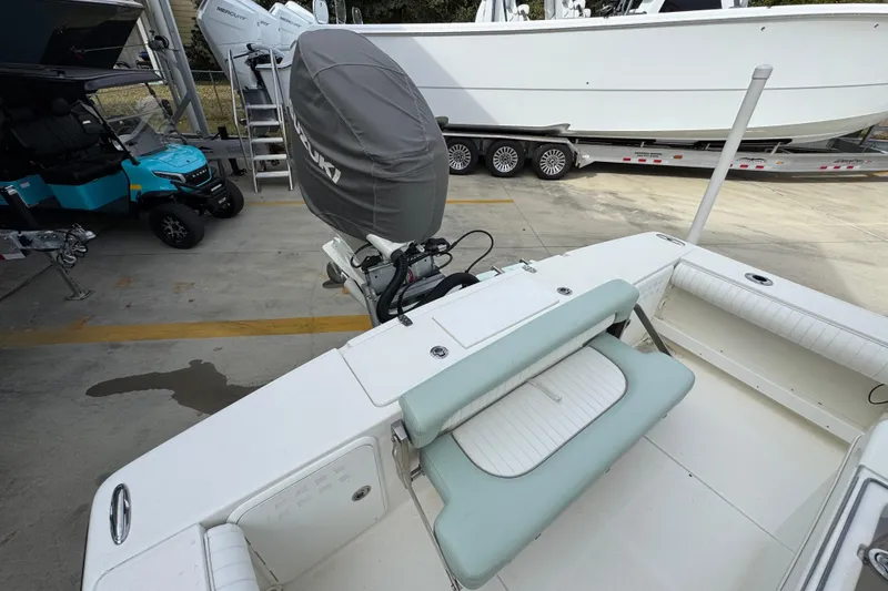 Slide: The Image of 2017 Sea Born FX25 Bay boat with Suzuki outboard motor, parked near a trailer. - 39