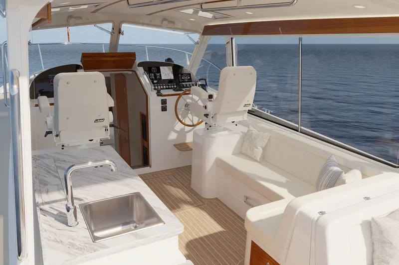 Slide: The Image of Manufacturer Provided Image: Luxurious 2026 MJM 38R yacht interior with helm, seating, and ocean view. - 5