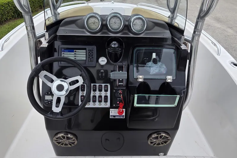 Slide: The Image of 2017 Barracuda 188 CCF boat dashboard with steering wheel and control panel. - 11