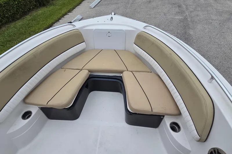 Slide: The Image of 2017 Barracuda 188 CCF boat interior with beige cushioned seating and white accents. - 6