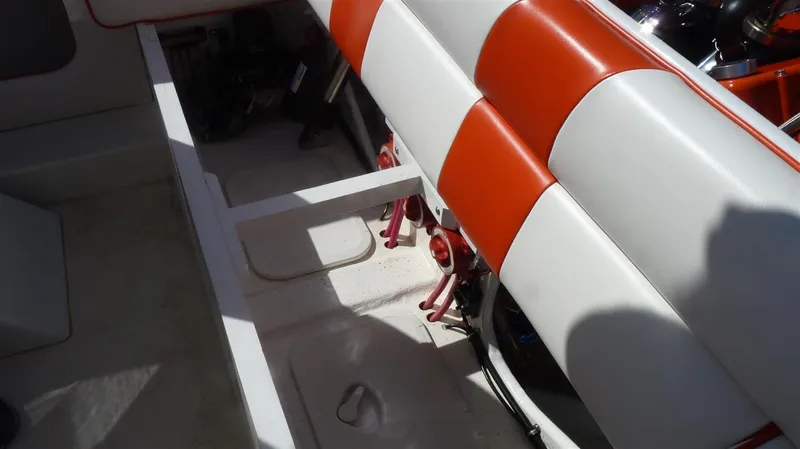 Slide: The Image of 1971 Magnum Sport boat interior with red and white seating. - 10