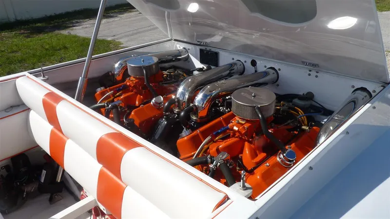 Slide: The Image of 1971 Magnum Sport boat with dual engines and open engine compartment. - 13
