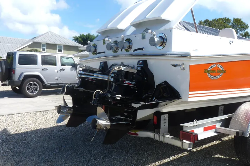 Slide: The Image of 1971 Magnum Sport boat with twin Mercury outboard engines on a trailer. - 3