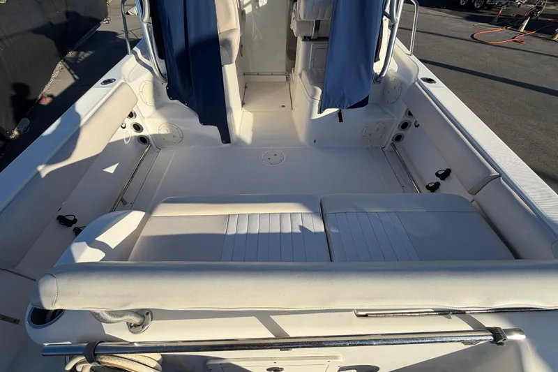Slide: The Image of 2017 Robalo R265 Walkaround boat interior with seating and storage compartments. - 16