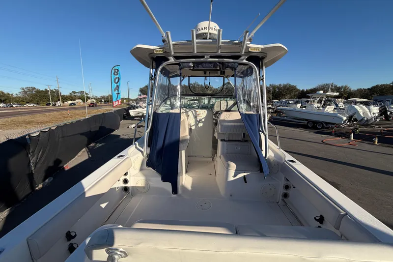 Slide: The Image of 2017 Robalo R265 Walkaround boat on display at a dealership. - 18