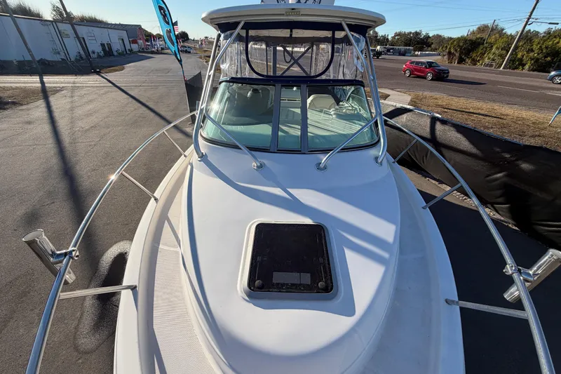 Slide: The Image of 2017 Robalo R265 Walkaround boat on display, showcasing sleek design and spacious deck. - 53