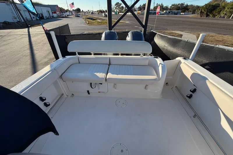 Slide: The Image of 2017 Robalo R265 Walkaround boat interior with seating and storage compartments. - 59