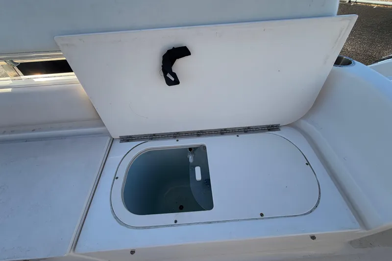 Slide: The Image of Open storage compartment on 2017 Robalo R265 Walkaround boat. - 64