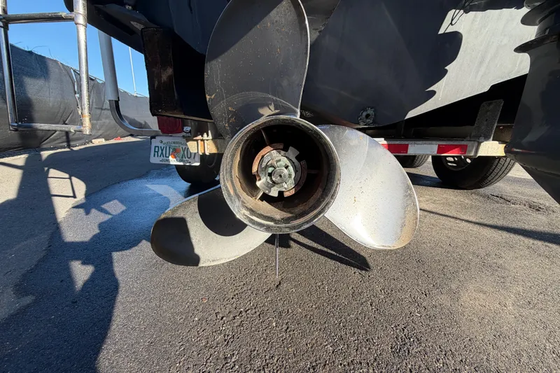 Slide: The Image of 2017 Robalo R265 Walkaround boat propeller and trailer detail. - 8