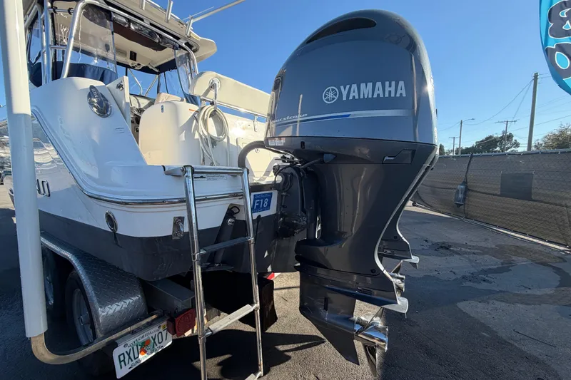Slide: The Image of 2017 Robalo R265 Walkaround boat with Yamaha outboard motor, parked on a trailer. - 9