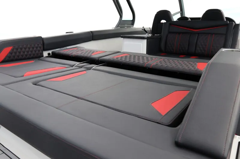 Slide: The Image of Interior of 2026 Monterey Elite 30 OB with luxurious black and red seating. - 21
