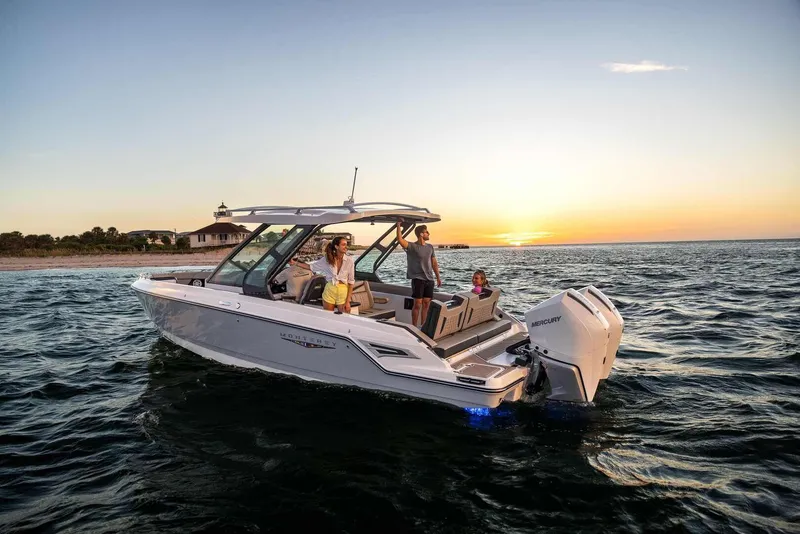 Slide: The Image of Monterey Elite 30 OB 2026 boat at sunset on the sea. - 3