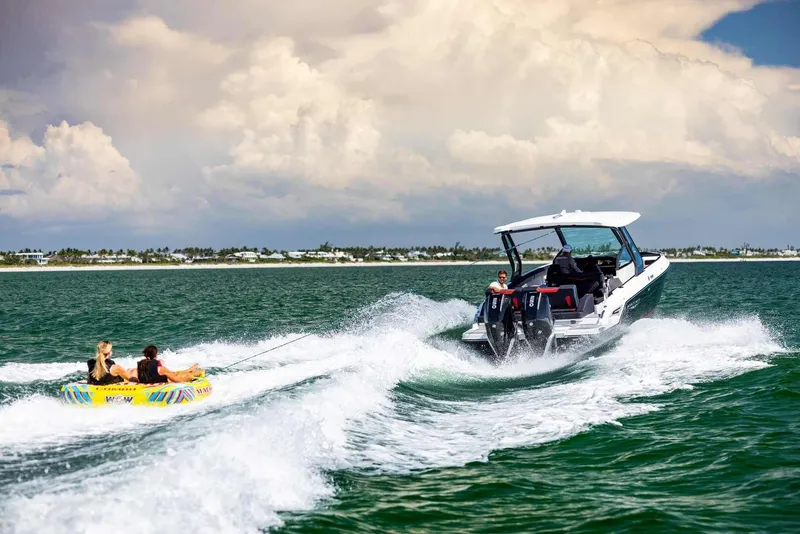 Slide: The Image of Monterey Elite 30 OB 2026 towing people on an inflatable tube in the sea. - 34