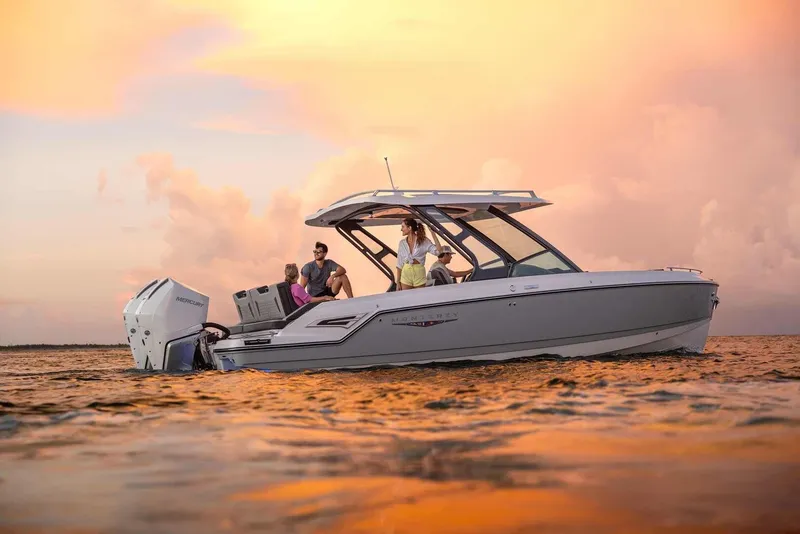 Slide: The Image of Monterey Elite 30 OB 2026 on water at sunset. - 42