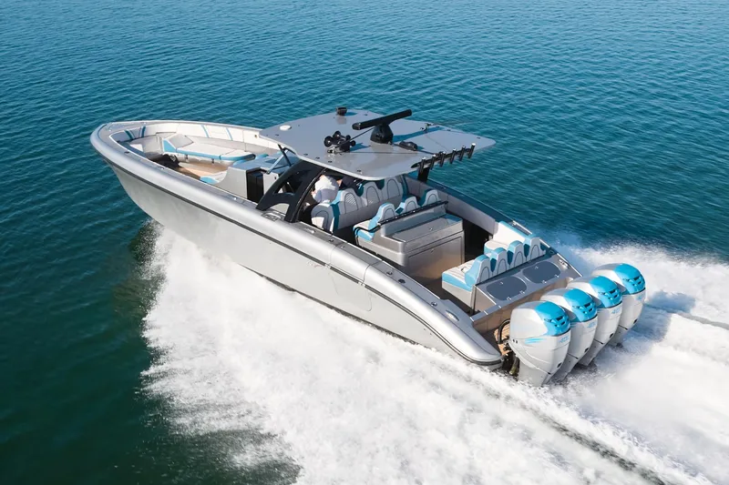 Slide: The Image of Midnight Express 43' Open boat cruising on clear blue water, showcasing powerful engines. - 1