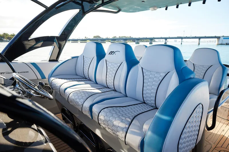 Slide: The Image of Luxurious seating on a Midnight Express 43' Open boat with scenic water view. - 16