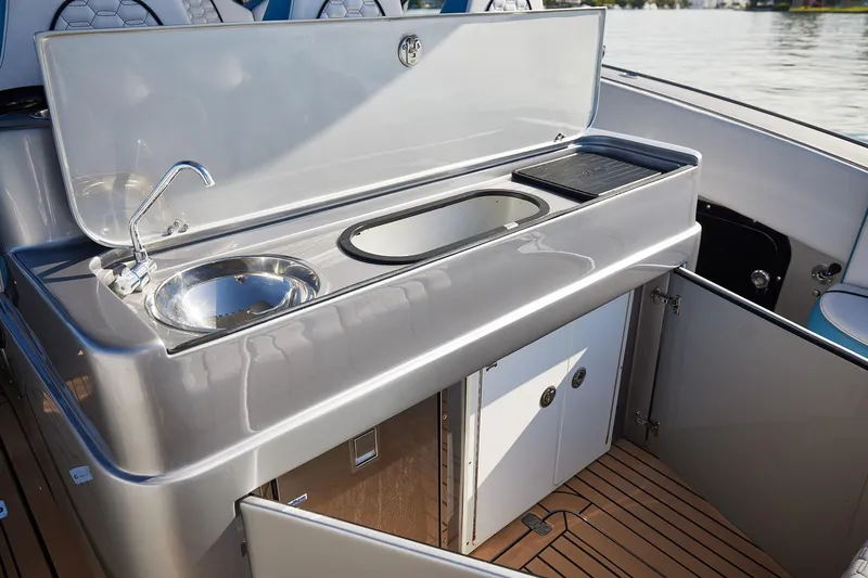 Slide: The Image of Luxury boat galley with sink and storage on Midnight Express 43' Open. - 17
