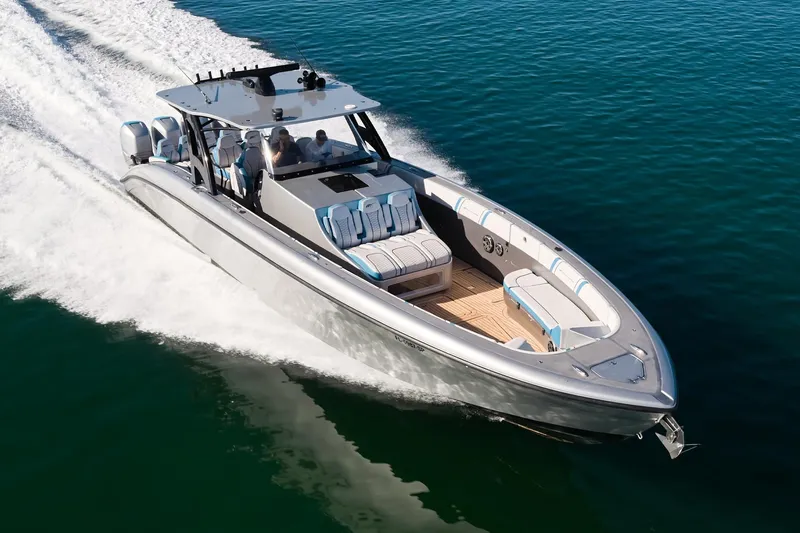 Slide: The Image of Midnight Express 43' Open boat cruising on clear blue water, showcasing sleek design and speed. - 3