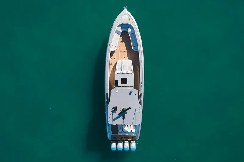 Slide: The Image of Aerial view of Midnight Express 43' Open boat on turquoise water. - 6