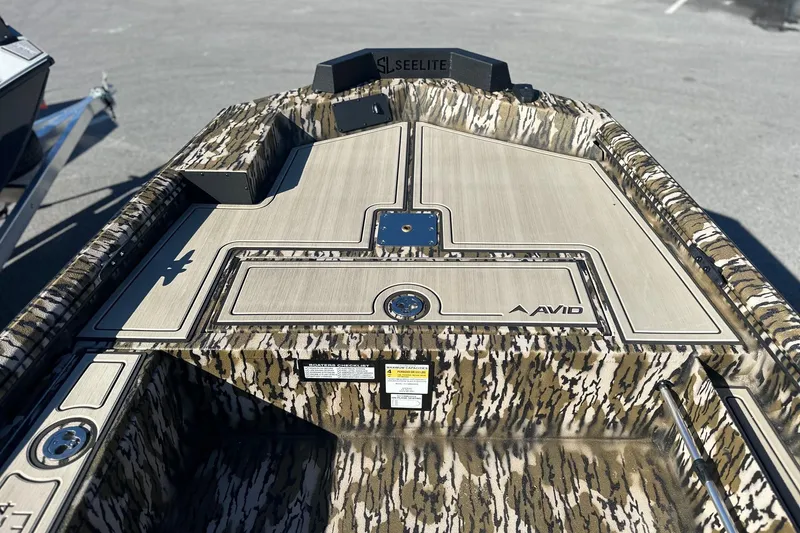 Slide: The Image of 2026 Avid 16 Commander boat with camouflage design and Seelite branding. - 16