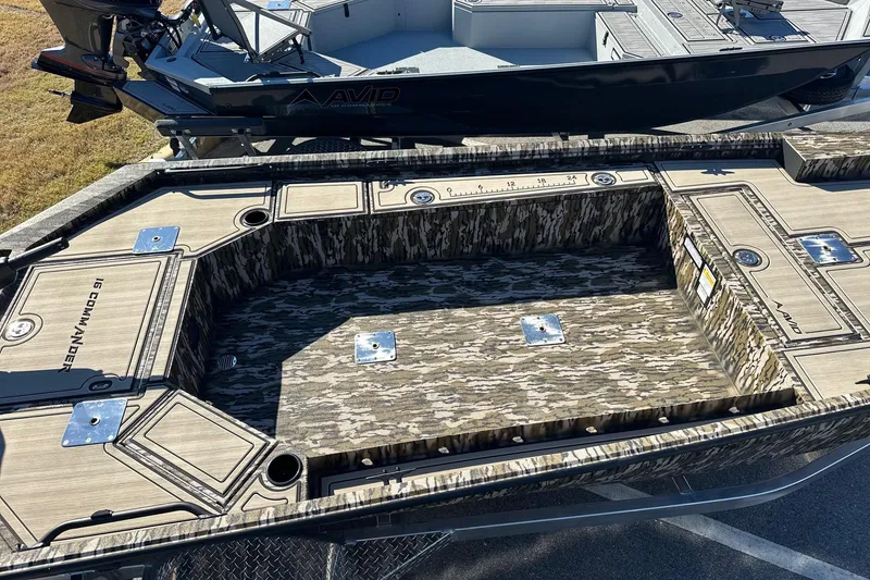 Slide: The Image of Avid 16 Commander 2026 boat with camouflage interior and fishing features. - 17