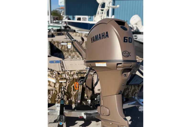 Slide: The Image of Yamaha 60 outboard motor on 2026 Avid 16 Commander boat, camouflage design. - 4