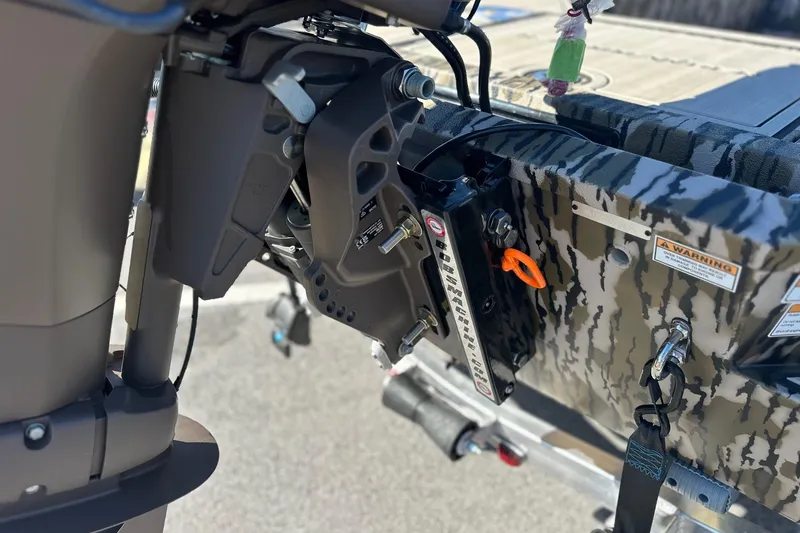 Slide: The Image of Close-up of 2026 Avid 16 Commander boat motor mount with camouflage design. - 8