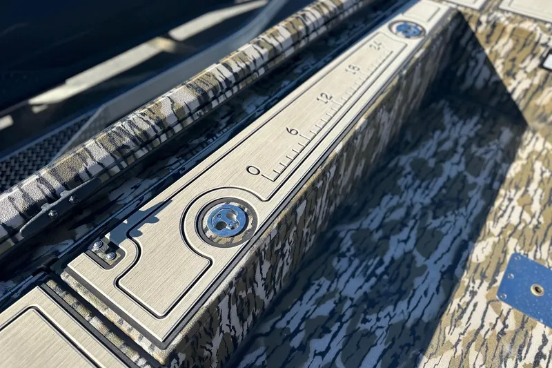 Slide: The Image of Avid 16 Commander 2026 boat with camo design and built-in measuring ruler. - 9