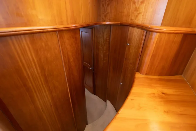Slide: The Image of Interior of 2001 Silverton 410 Sport Bridge with polished wood paneling and door. - 17