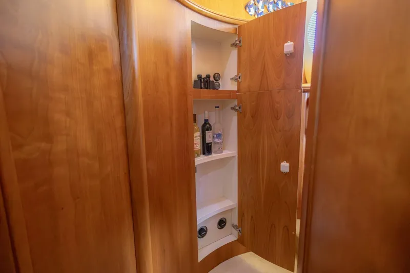 Slide: The Image of Wooden cabinet interior on a 2001 Silverton 410 Sport Bridge yacht. - 18