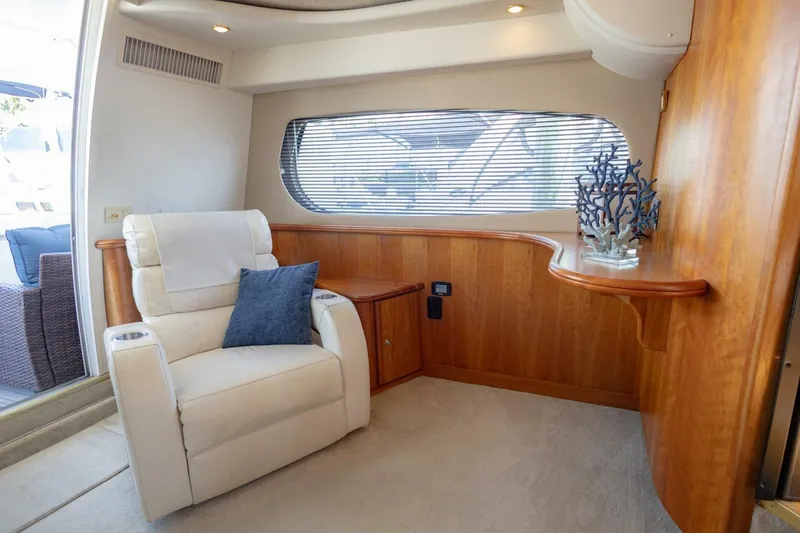 Slide: The Image of Luxurious interior of 2001 Silverton 410 Sport Bridge with plush seating and elegant wood accents. - 22