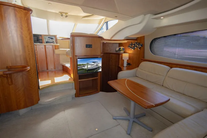 Slide: The Image of Luxurious interior of 2001 Silverton 410 Sport Bridge yacht with elegant wood finishes. - 23