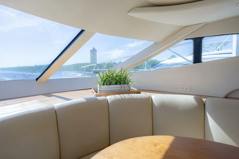 Slide: The Image of Interior of 2001 Silverton 410 Sport Bridge yacht with plush seating and scenic windows. - 33